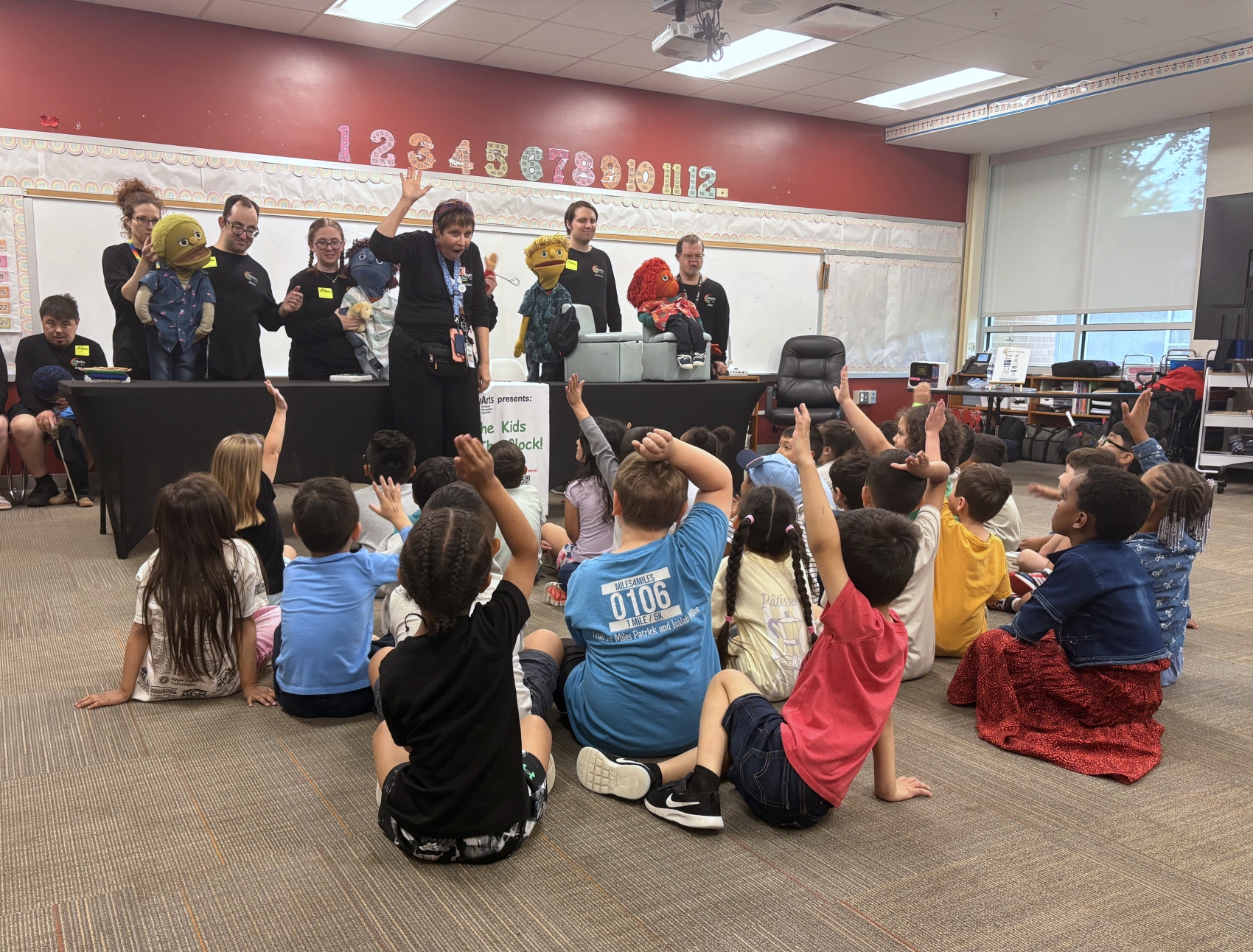 A group of children take part in an activity with Why Arts Inc. 