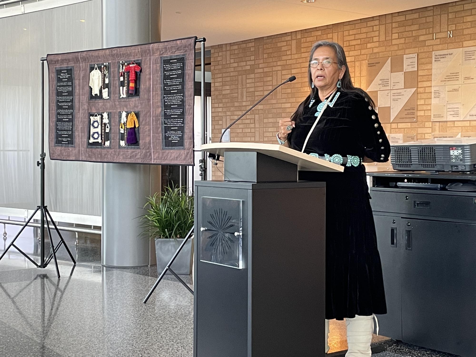 Susan Hudson speaks at the IQM