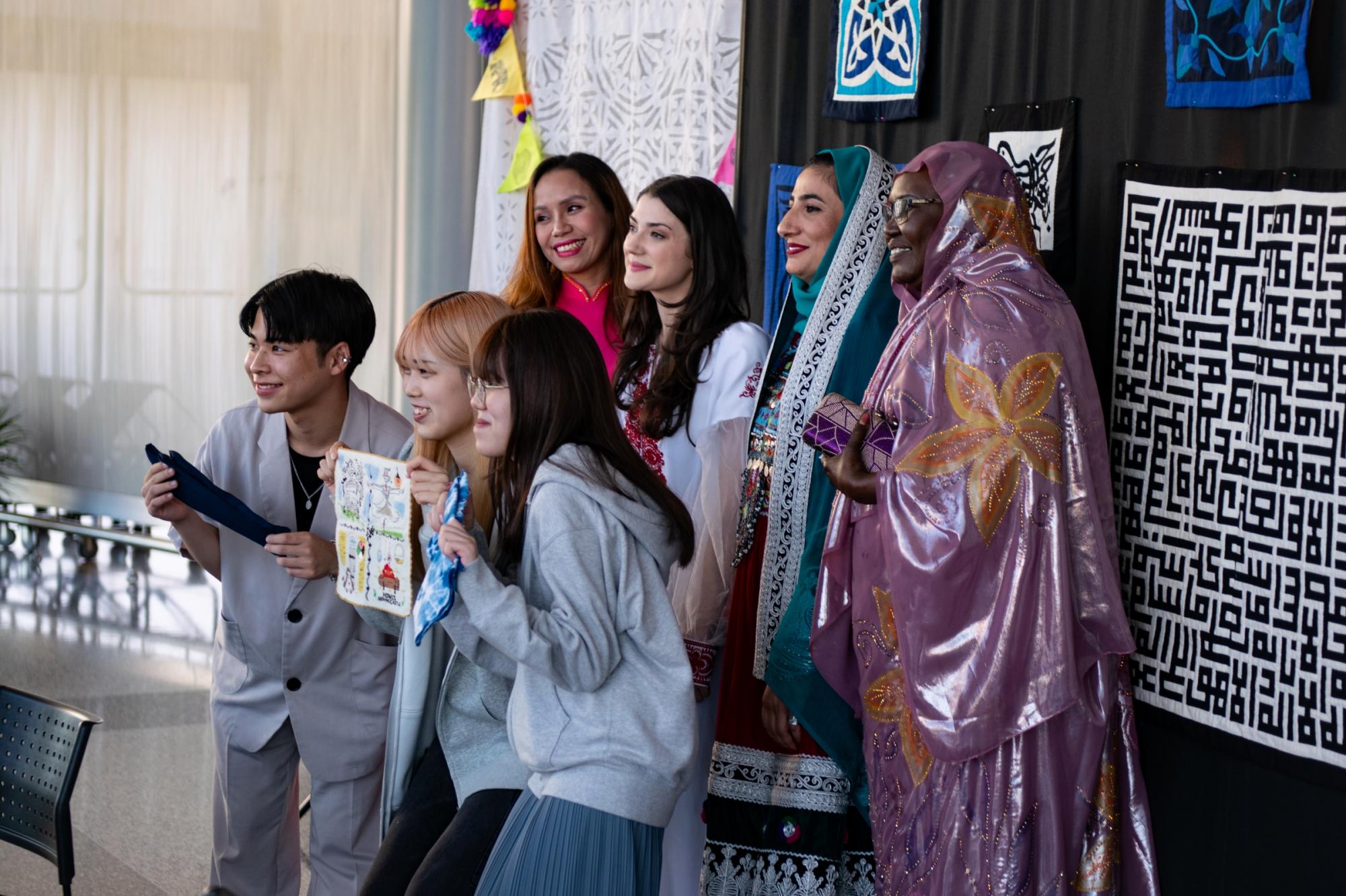 People share their cultural textiles during a show and tell. 