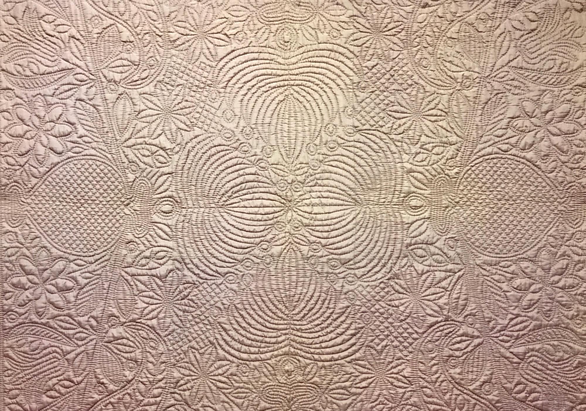 detail of pale purple wholecloth quilt