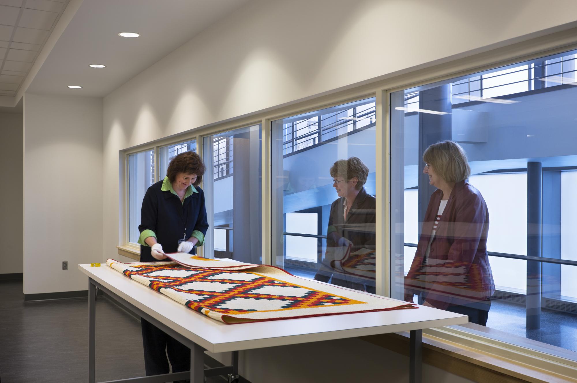 People Watching Quilt Preparation